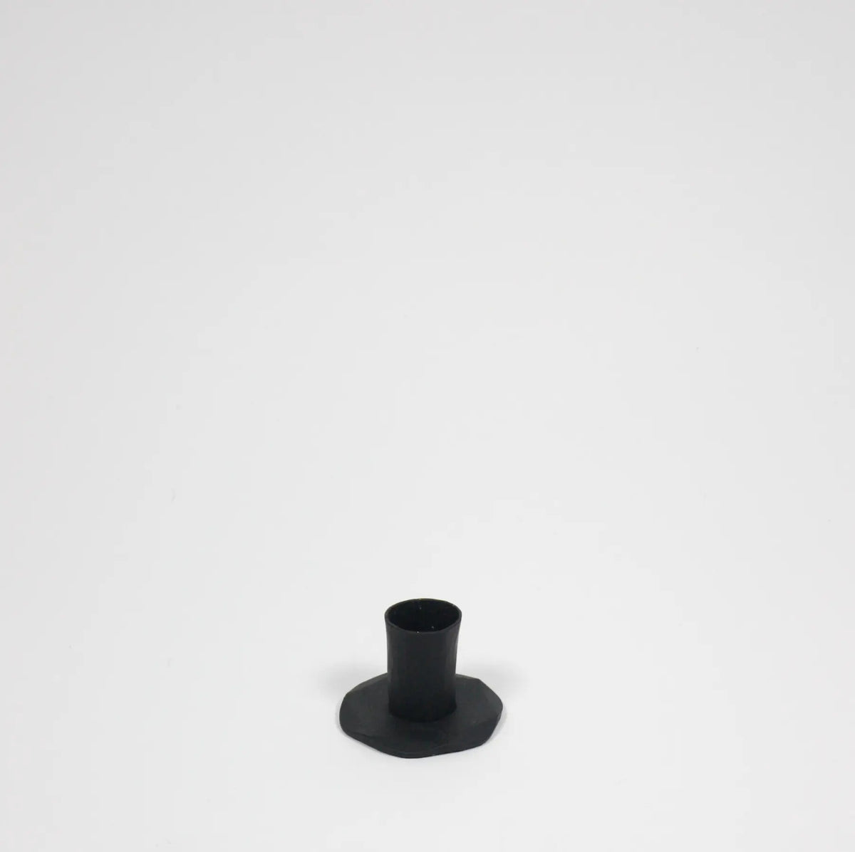 Adrian short black iron candle holder by Olsson & Jensen without a candle