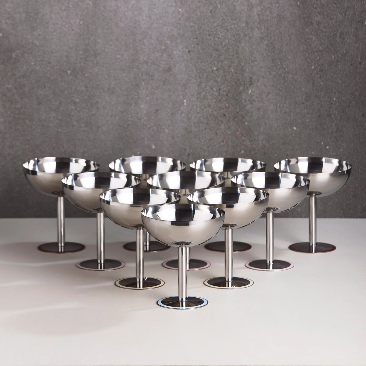 Elegant stainless steel champagne coupe with blue base