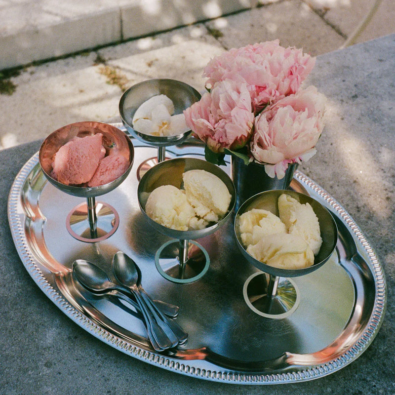stainless steel ice cups by aida filled with ice cream on a serving tray for elegant dessert presentation
