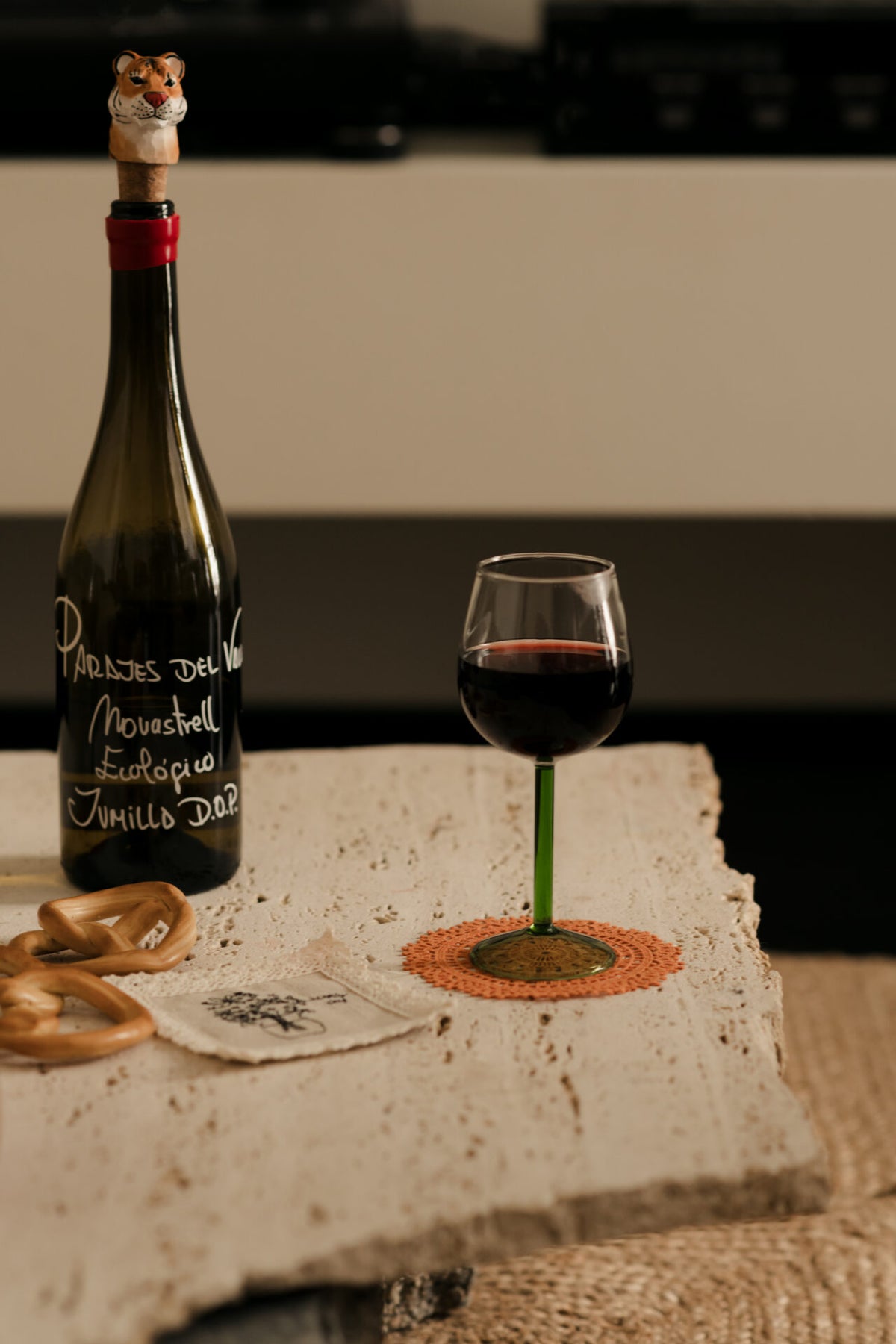 Annabelle wine glass by Olsson & Jensen with red wine on a stone table