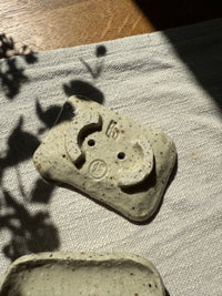 Rustic rectangular ceramic soap holder with raised base and drainage holes