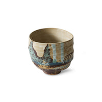 Hand-finished stoneware coffee cup with raw edges and unique markings.
