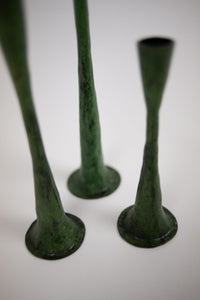 Close-up of the flared bases of the Ashraf green candlesticks by Olsson & Jensen