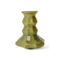 Front view of the olive green Silhouette glass vase, showing its tiered, hexagonal faceted form and flared trumpet rim