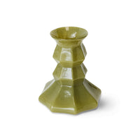 Olive green Silhouette glass vase with a tiered, faceted silhouette, photographed against a white background