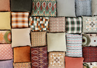 collection of different coloured cushions