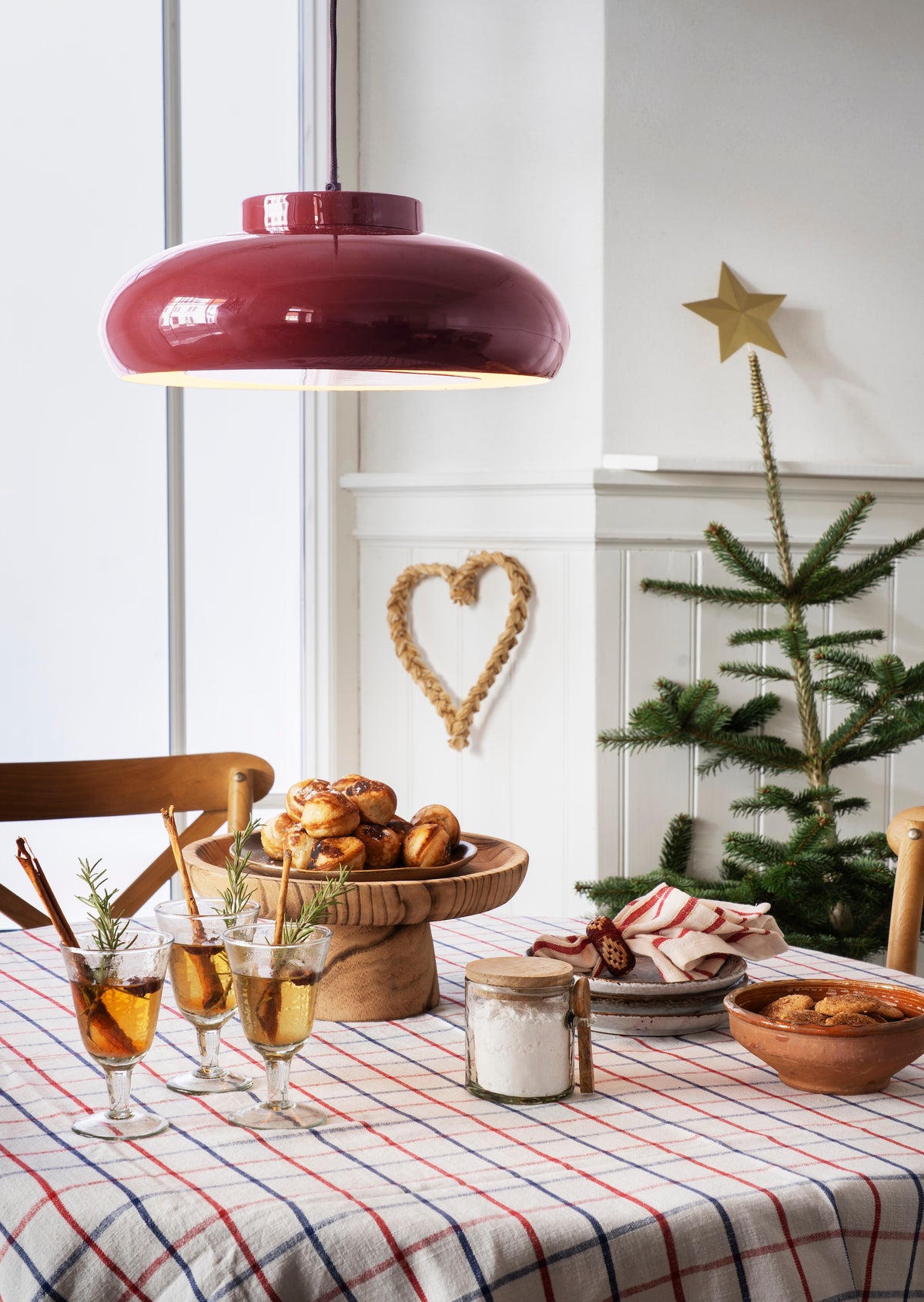 speckled stoneware cake plate styled with matching ceramics for relaxed dining
