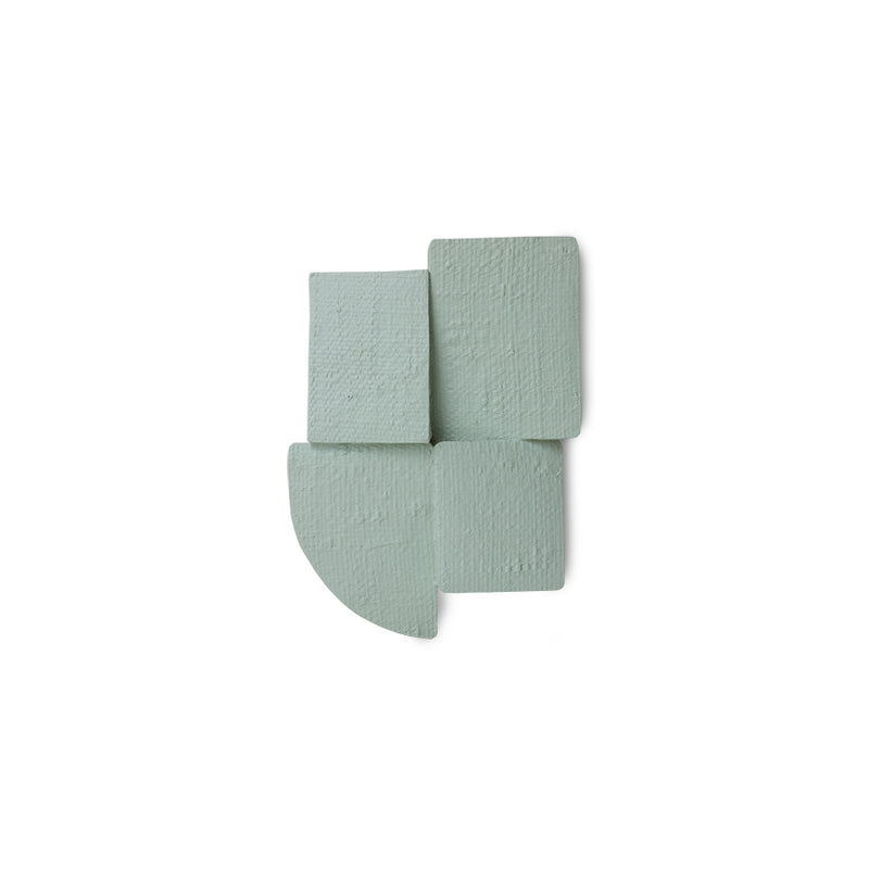 Sage green Levels wall sculpture on white background