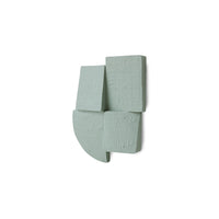 Alternate angle of sage green Levels wall sculpture showing layered blocks