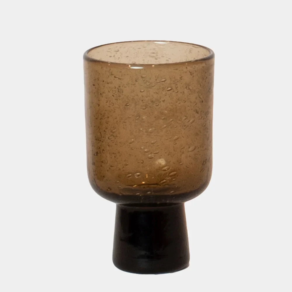 Bari amber brown bubble glass on a dark foot by Olsson & Jensen on a white background