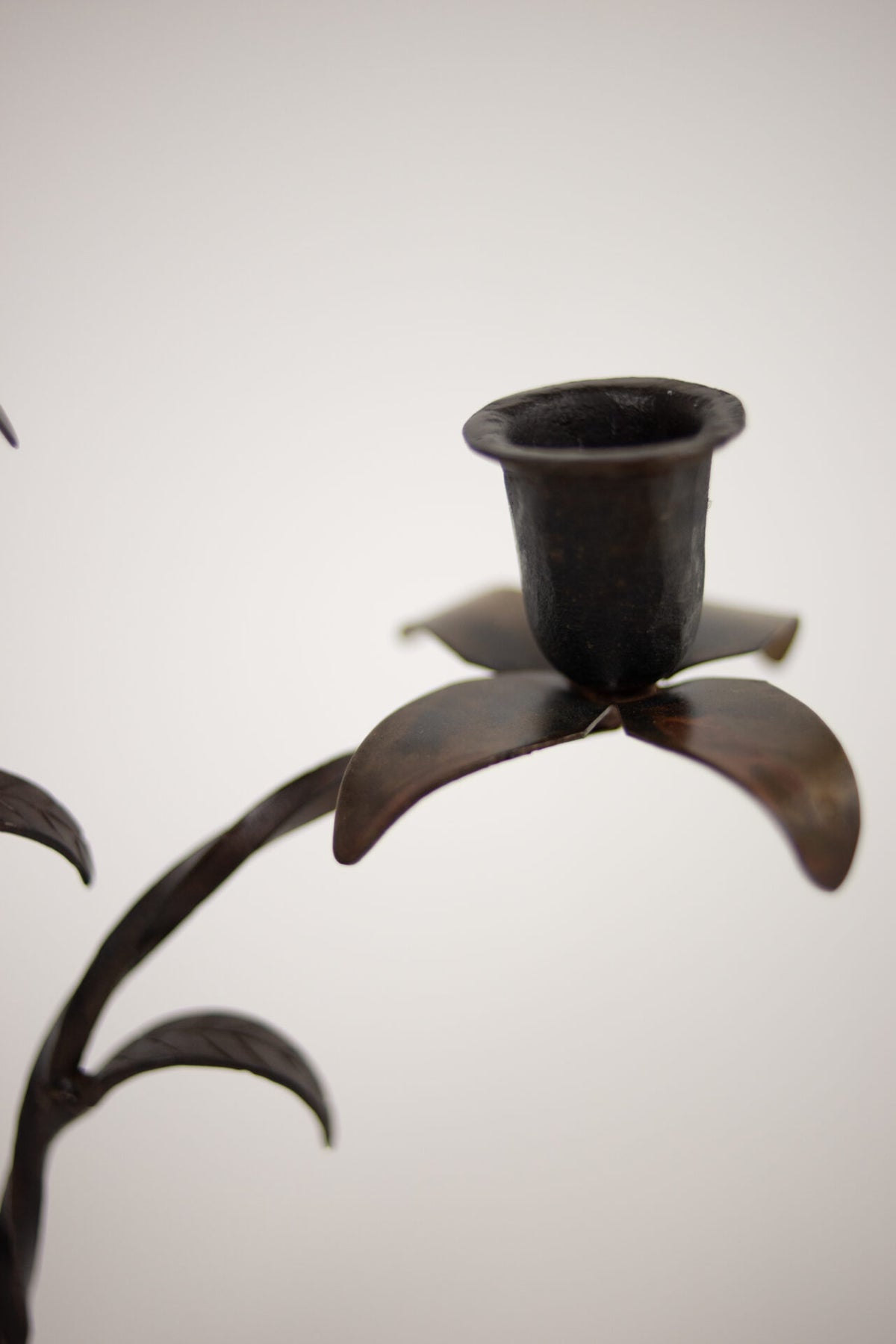 Close-up of a flower-shaped cup on the Bellora candelabra by Olsson & Jensen