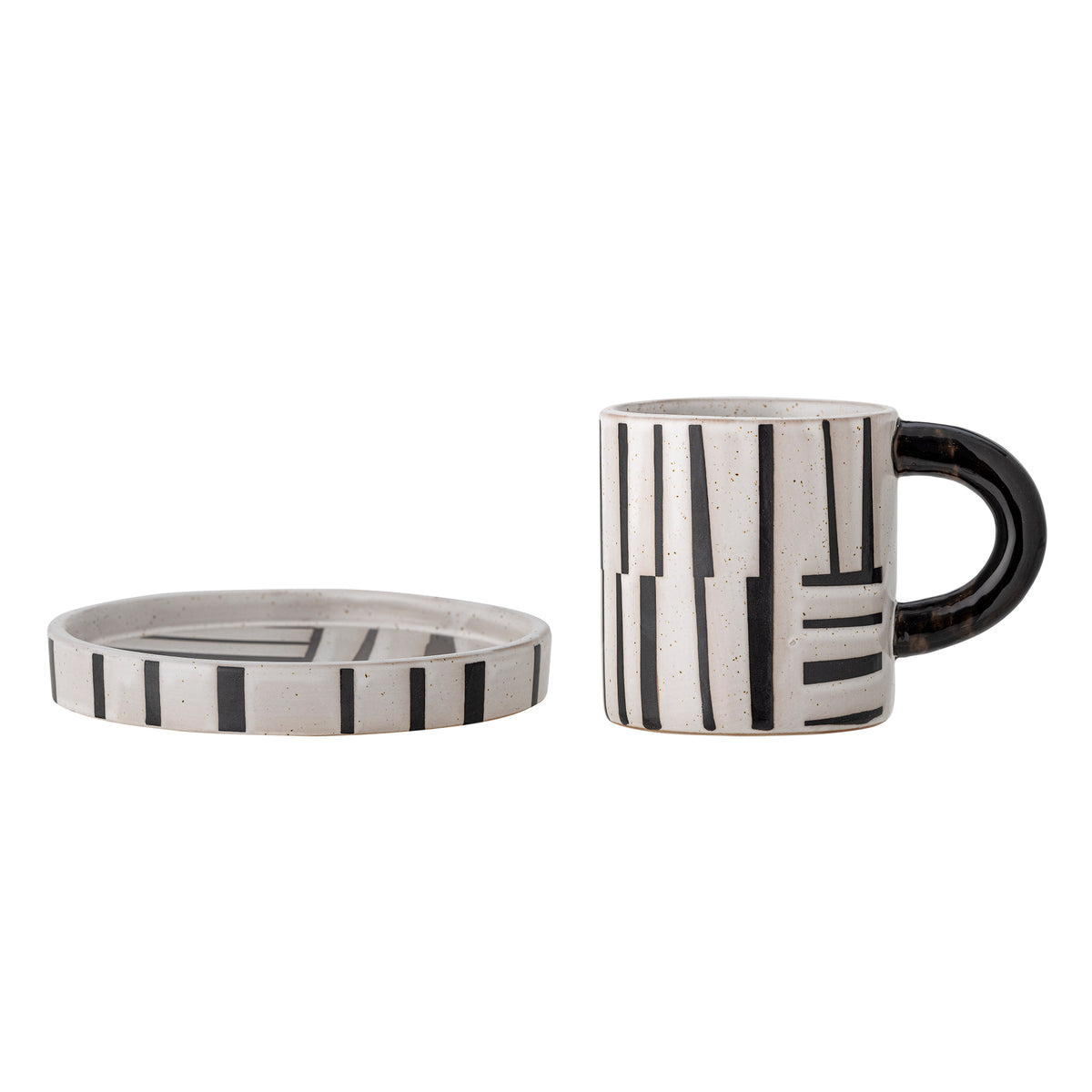 Black handle coffee cup with matching patterned saucer