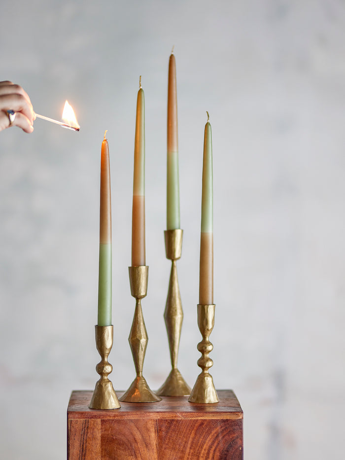 set of handmade dip dye bloom­ingville burma candles in green tones on brass candle holders