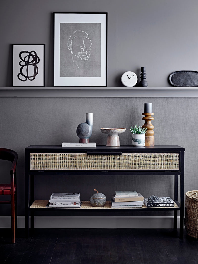 black stoneware candle holder styled on modern grey console with Nordic decor