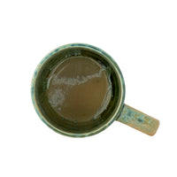 top view of green bloomingville milani mug showing unique reactive glaze interior
