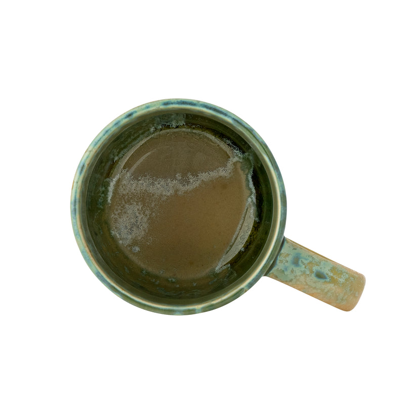top view of green bloomingville milani mug showing unique reactive glaze interior
