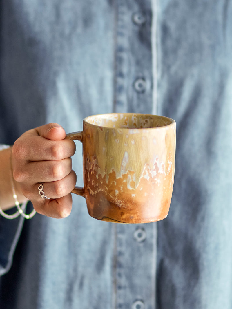 hand holding bloomingville milani mug showing reactive glaze details

