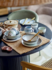 grey bloom­ingville paula cup styled on nordic table with reactive glaze bowls and plates
