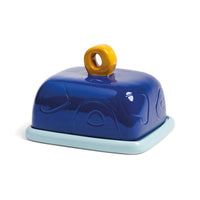Glossy blue &Klevering butter dish with yellow loop handle adding a joyful pop of colour to breakfast.