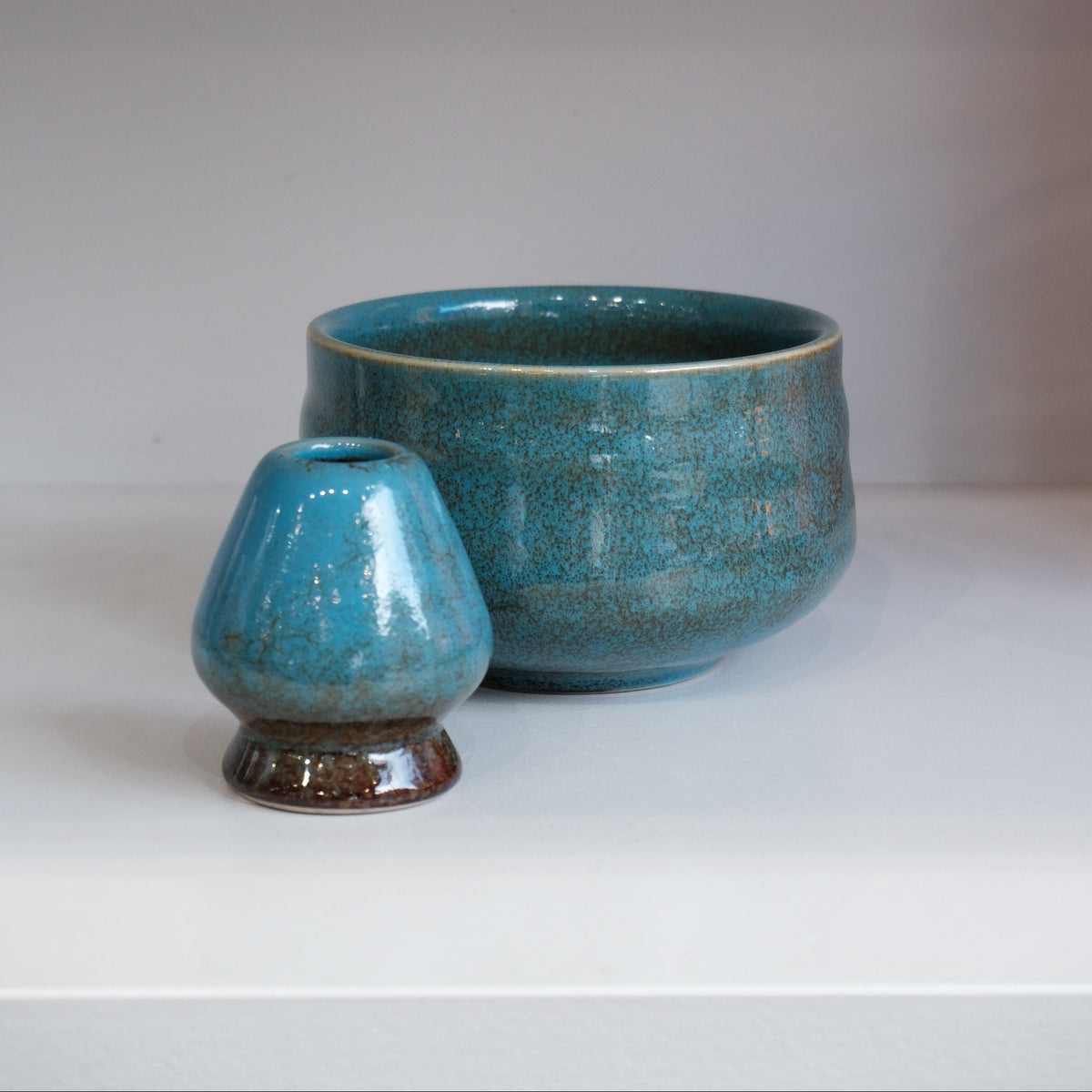 blue chasen naoshi ceramic matcha whisk stand with coordinating matcha bowl
