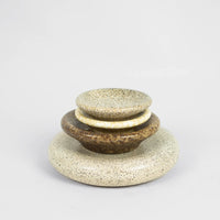 Stack of Boel speckled stoneware plates and bowls by Olsson & Jensen in mixed colours