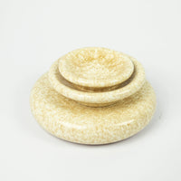 Stack of Boel yellow speckled stoneware pieces by Olsson & Jensen