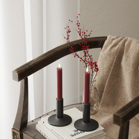 Pair of 15cm bordeaux LED dinner candles on chair with berry stems