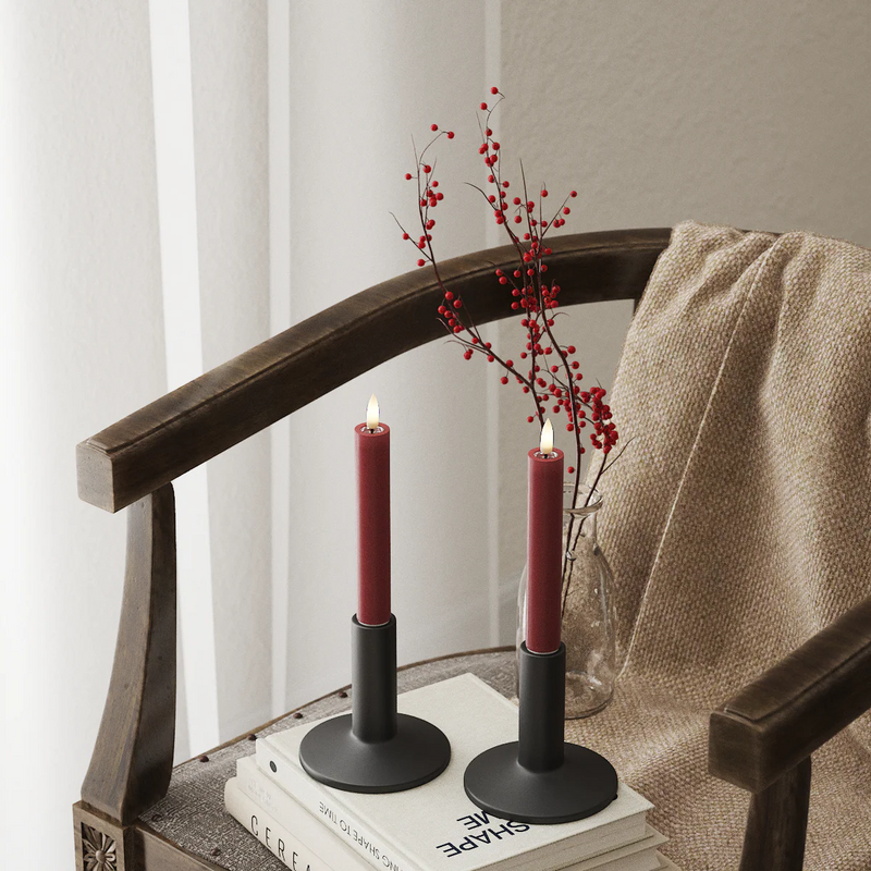 Pair of 15cm bordeaux LED dinner candles on chair with berry stems