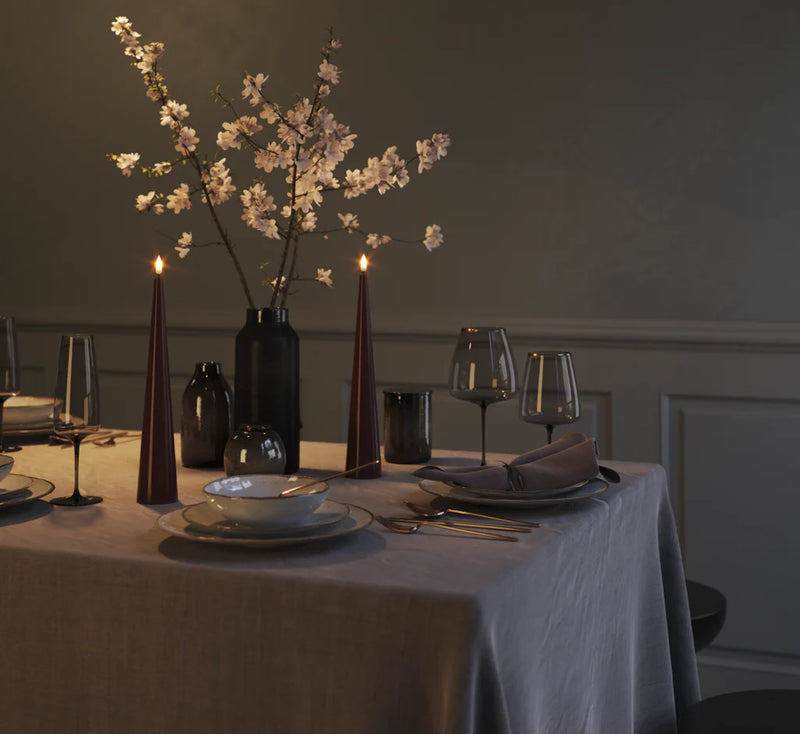 deep red bourgogne led cone candles styled on dining table for warm evening ambience
