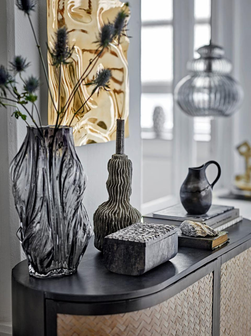 Grey sculptural candle holder by Bloomingville styled with modern decor