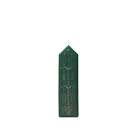 Broste Copenhagen Casa Calendar Candle, a tall dark green house-shaped candle with gold pattern, on a white background