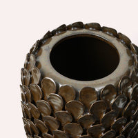 Close-up of the Dorthea Vase rim showing the bronze reactive glaze and overlapping disc texture