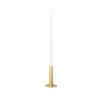 Large brass Maro candle holder holding a white taper candle
