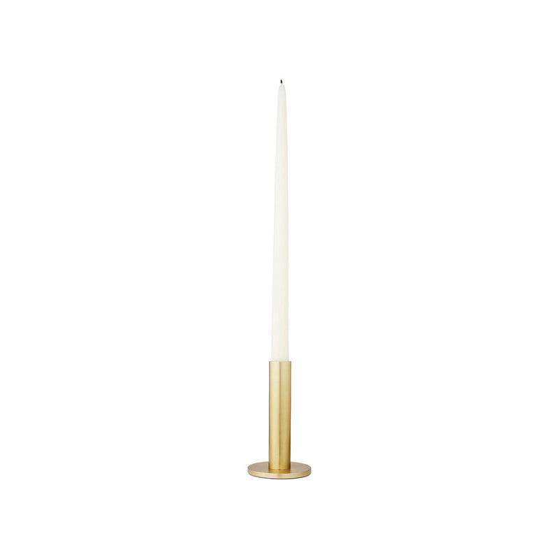 Large brass Maro candle holder holding a white taper candle