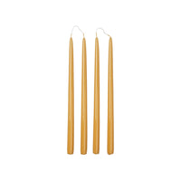 Four Broste Copenhagen Smooth Glossy Taper Candles in Golden Yellow on a white background