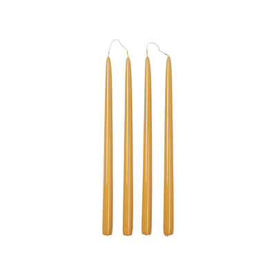 Four Broste Copenhagen Smooth Glossy Taper Candles in Golden Yellow on a white background