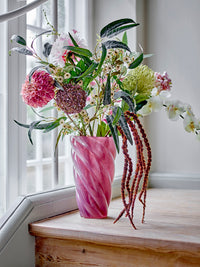 Brown allium faux flower styled in pink vase arrangement