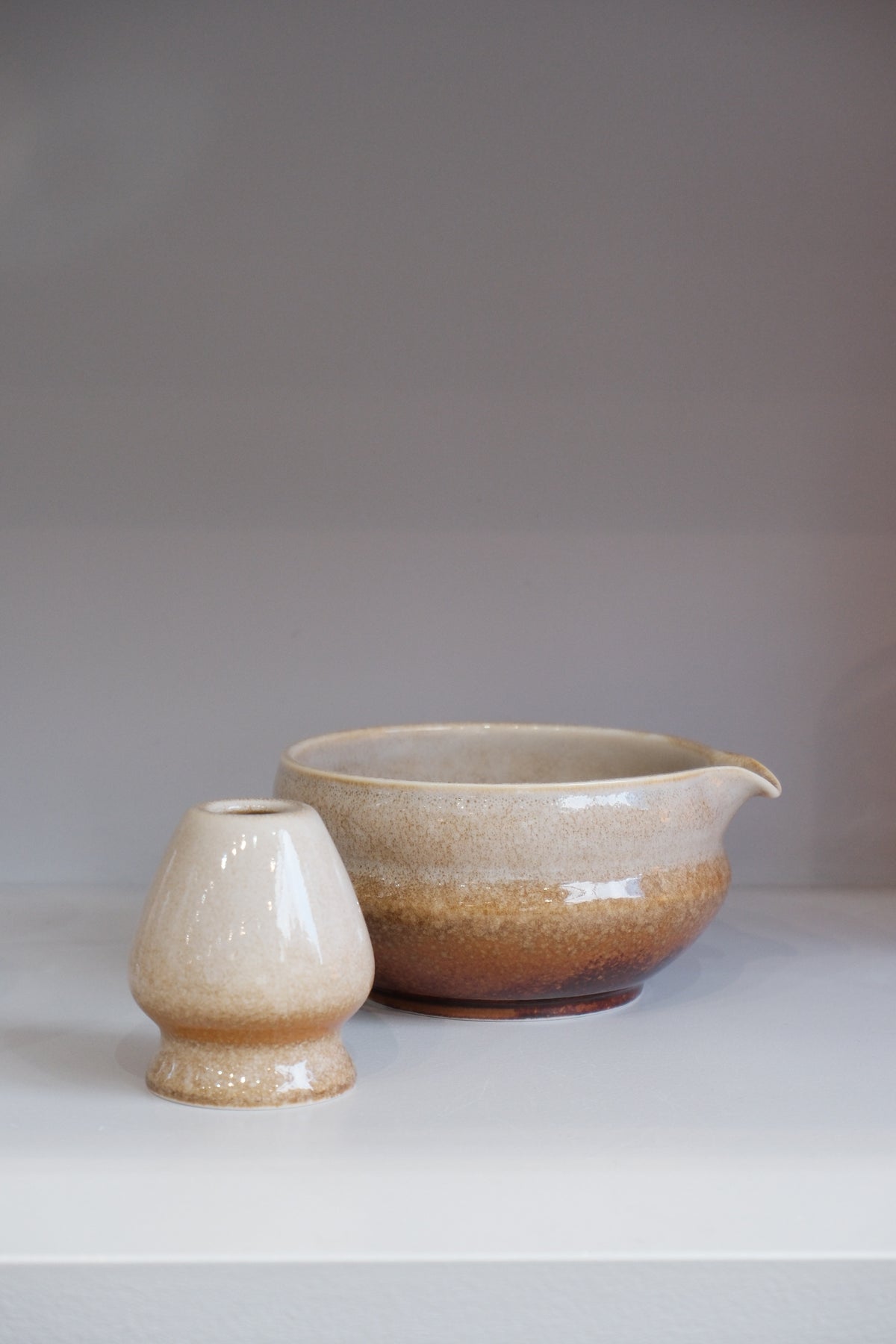 side view of brown gradient glazed matcha bowl set showing pouring spout detail
