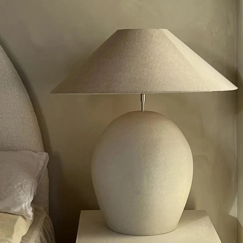 Calais lamp base by Olsson & Jensen with a linen shade styled in a calm bedroom
