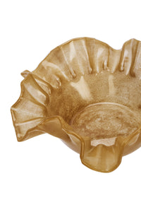 close-up of caramel glass ruffle bowl showing wavy edge and glossy finish
