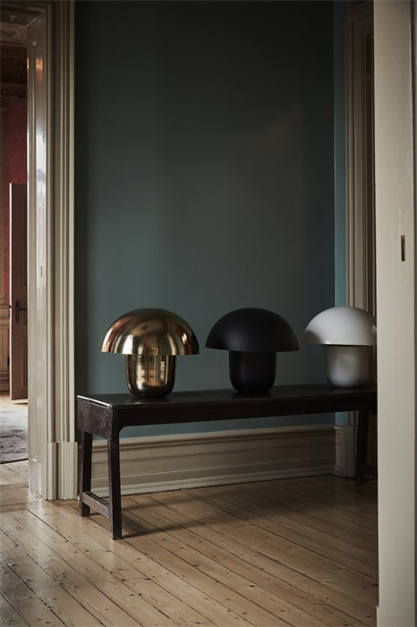 Carl-Johan mushroom lamps by Olsson & Jensen in gold, black and white on a hallway bench