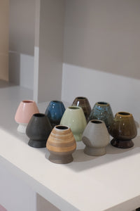 collection of ceramic chasen naoshi matcha whisk stands in multiple colours including bark
