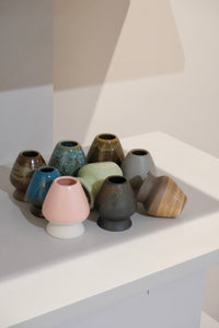 ceramic chasen naoshi matcha whisk stands in multiple colours including graphite
