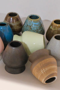 ceramic chasen naoshi matcha whisk stands in multiple colours including pebble
