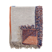 Recycled cotton throw by Bloomingville folded showing coral and blue fringes