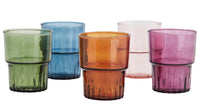 set of colourful drinking glasses in green blue amber rose and purple
