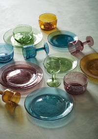 mixed coloured wine glasses including amber in a playful table setting
