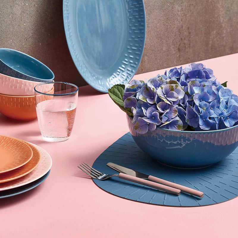 Pink-handled cutlery set on modern Nordic dining table
