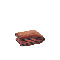 folded cotton velvet mattress in burnt red with black woven band