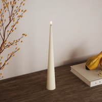 Cream 20cm LED cone candle on a wooden tabletop
